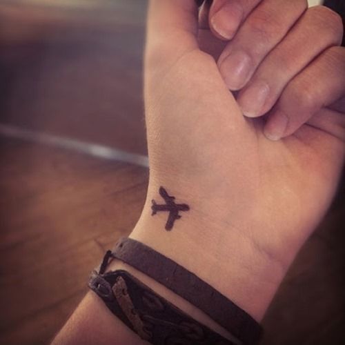 Small plane tattoo