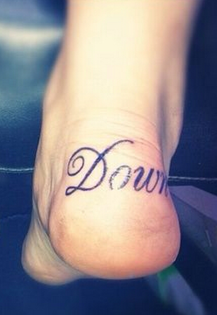 Letter heel tattoo