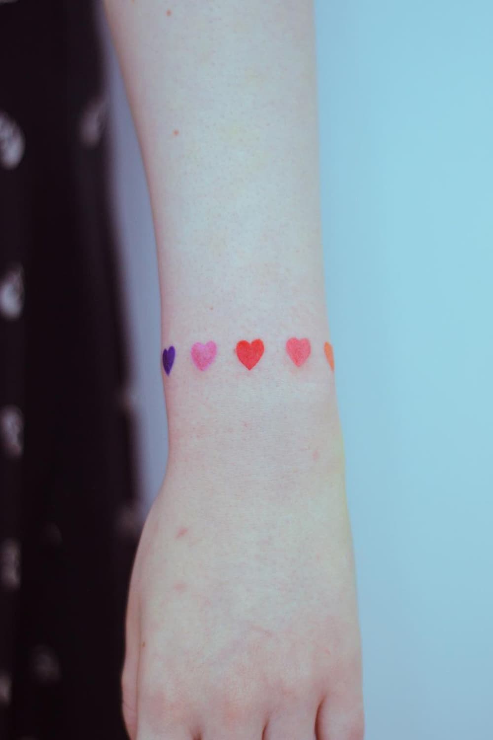 Colorful heart armband tattoo