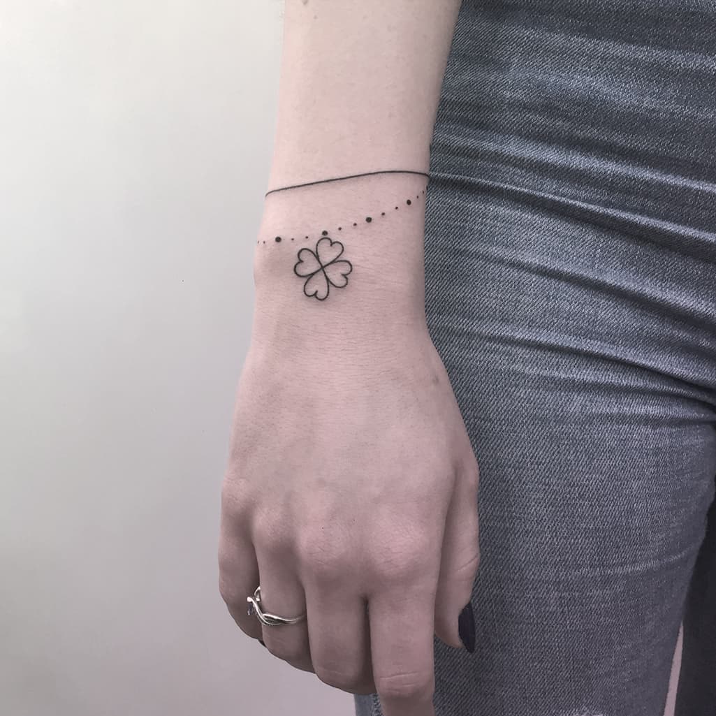 Four leaf clover armband tattoo