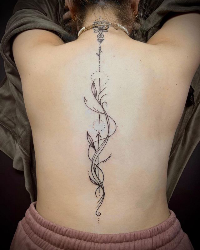 elegant spine tattoo