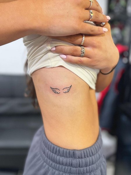 Angel Wing Tattoo On Rib