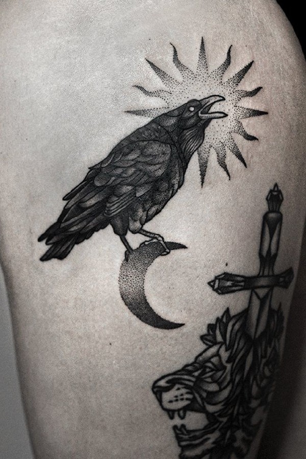 Black crow tattoo with sun background