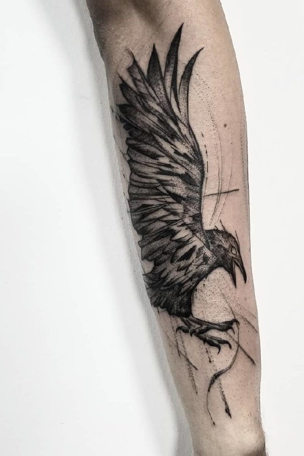 Half sleeve crow tattoo in black and grey