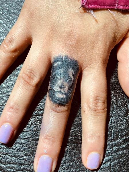 Lion Finger Tattoo