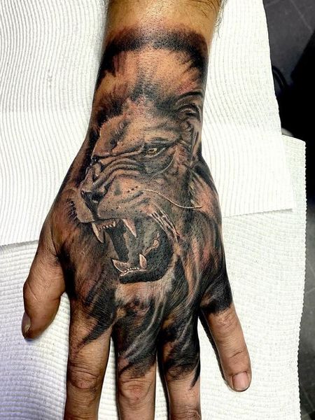 Lion Hand Tattoo