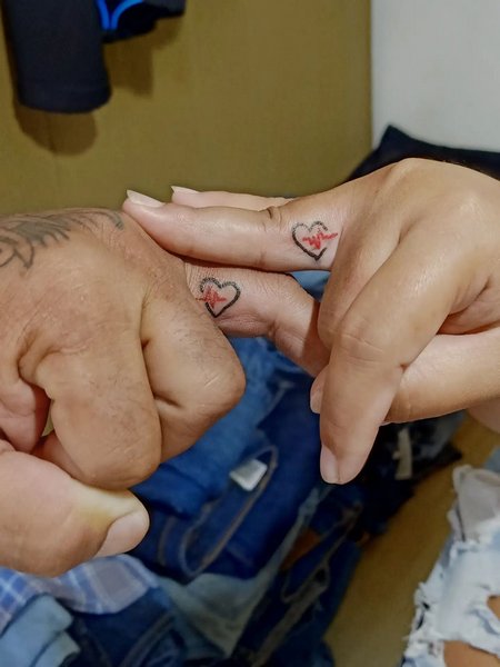 Matching Couple Finger Tattoo