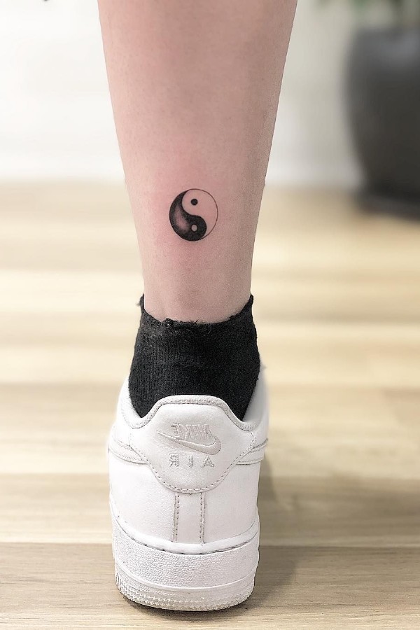 Small yin yang tattoo