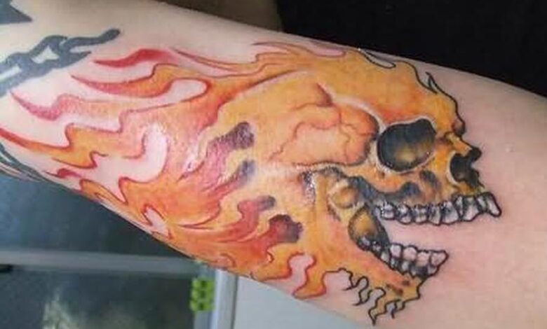 skull fire n flames tattoo on arm