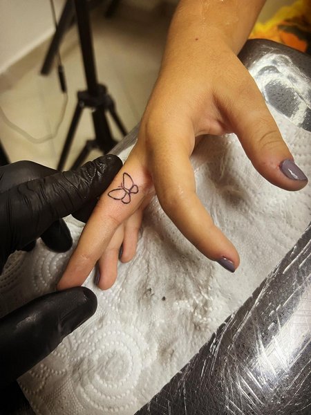 Butterfly Finger Tattoo