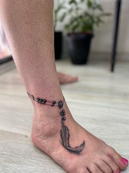 Feather Rosary Tattoo
