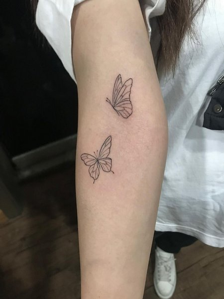 Minimalist Butterfly Tattoo