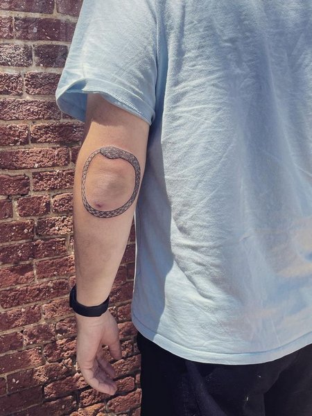 Ouroboros Elbow Tattoo