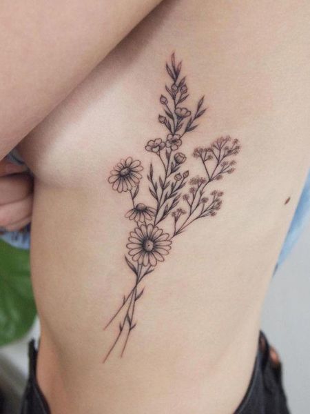 Rib Daisy Tattoo