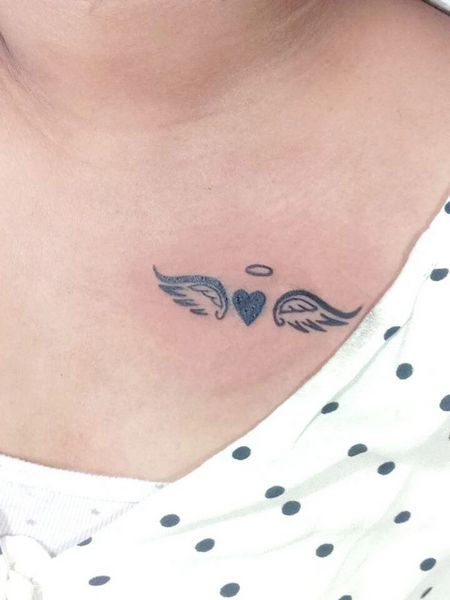 Angel Wing Collarbone Tattoo