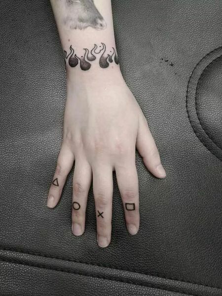 Black Finger Tattoo