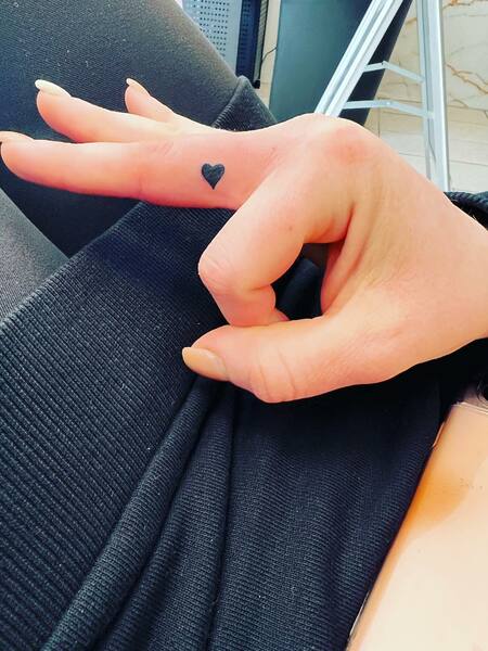 Black Heart Finger Tattoo