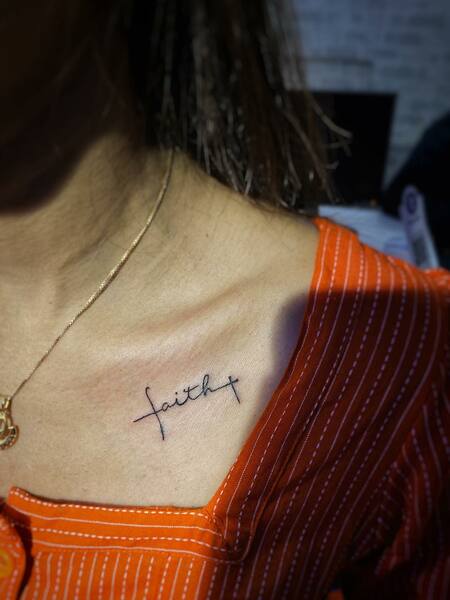 Faith Cross Tattoo On Collarbone