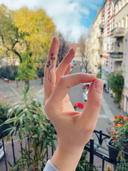 Flower Finger Tattoo