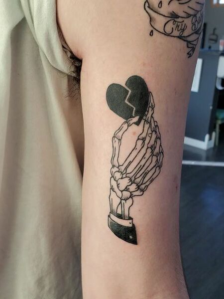 Heart And Skeleton Hand Tattoo