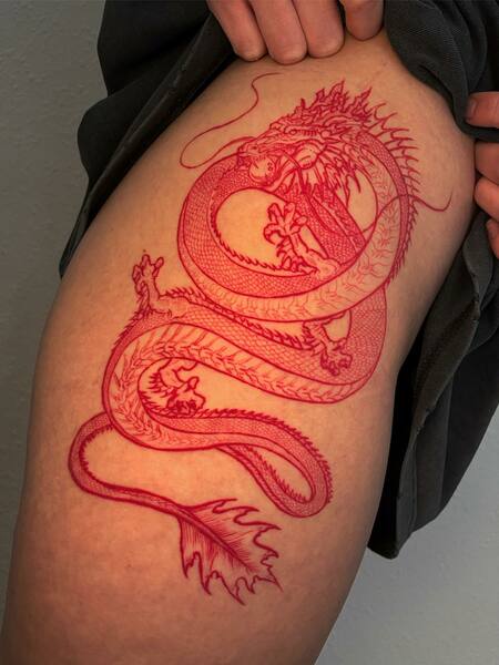 Red Thigh Tattoo