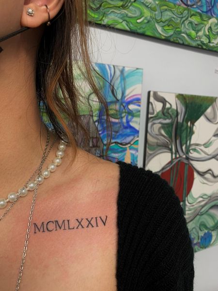 Romen Numeral Collarbone Tattoo