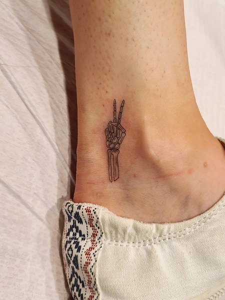 Small Skeleton Hand Tattoo