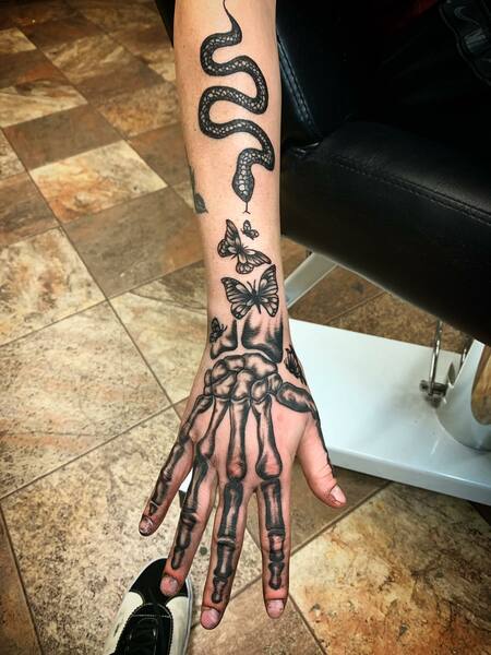 Snake Butterfly And Skeleton Bone Hand Tattoo