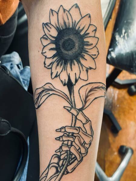 Sunflower And Skeleton Hand Tattoo