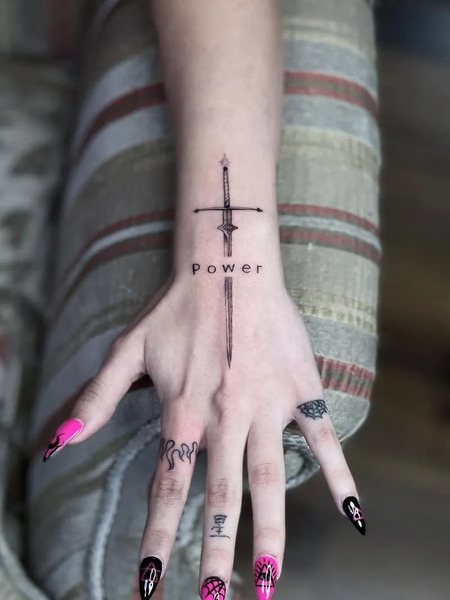 Sword tattoo on hand
