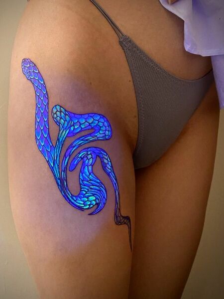 UV Thigh Tattoo