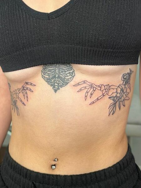 Underboob Skeleton Hand Tattoo