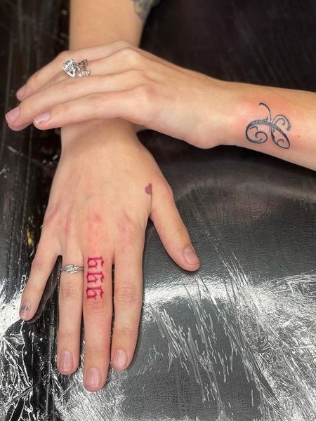 999 Tattoo On Finger
