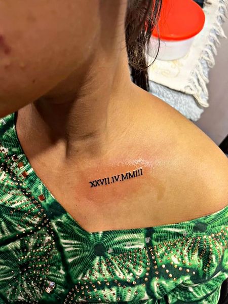 Artistic Roman Numeral Tattoo