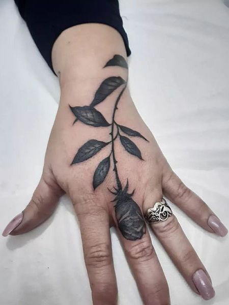 Black Rose Tattoo On Finger