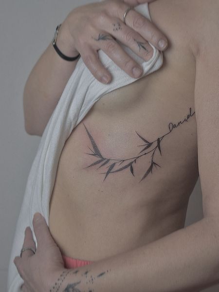 Fine Line Rib Tattoo