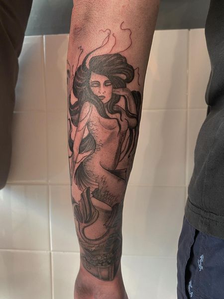 Forearm mermaid tattoo