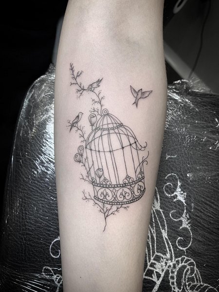 Minimalist Bird Cage Tattoo