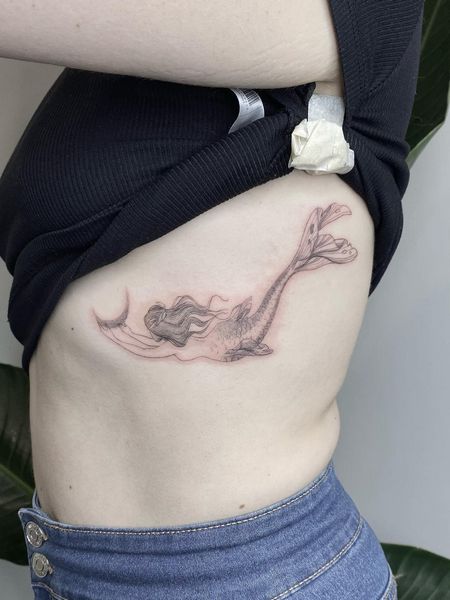 Rib mermaid tattoo