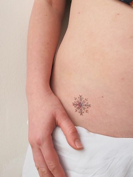 Snowflake Belly Tattoo