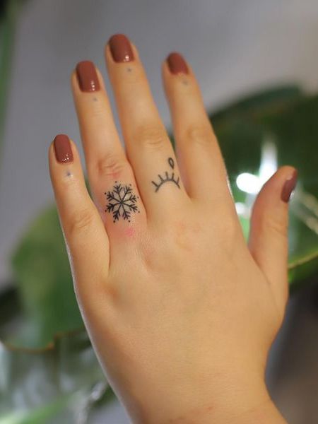 Snowflake Finger Tattoo