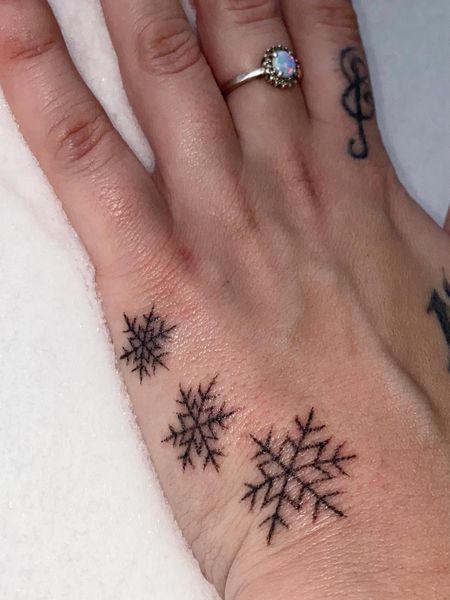 Snowflake Hand Tattoo