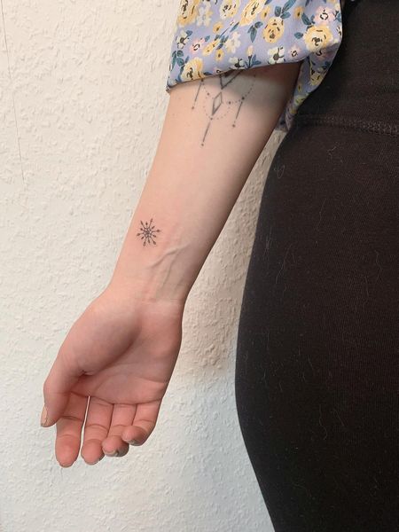 Tiny Snowflake Tattoo