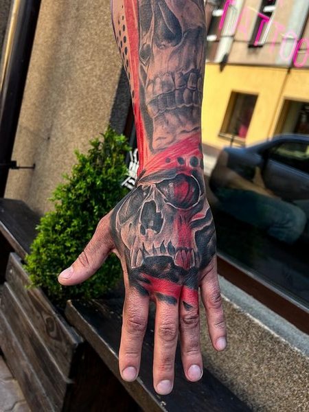 Trash Polka Hand Tattoo