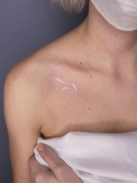 White Collarbone Tattoo