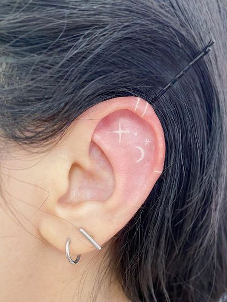 White Ear Tattoo