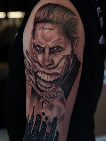 hand joker tattoo