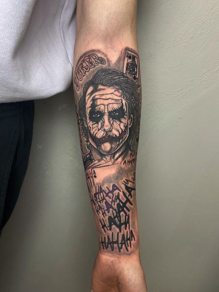 joker forearm tattoo