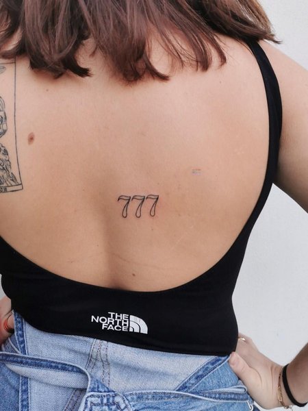 777 Tattoo On Back