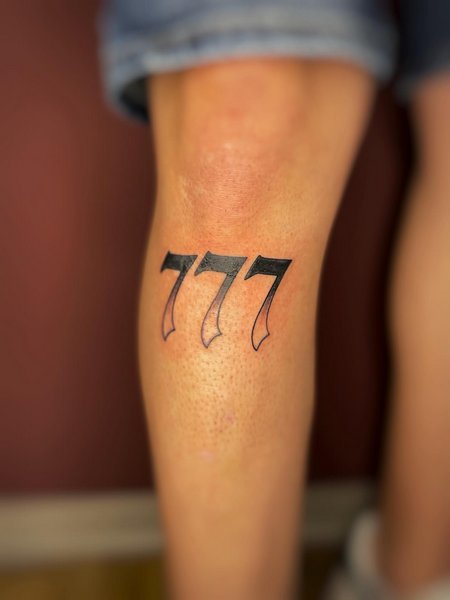 777 Tattoo On Leg